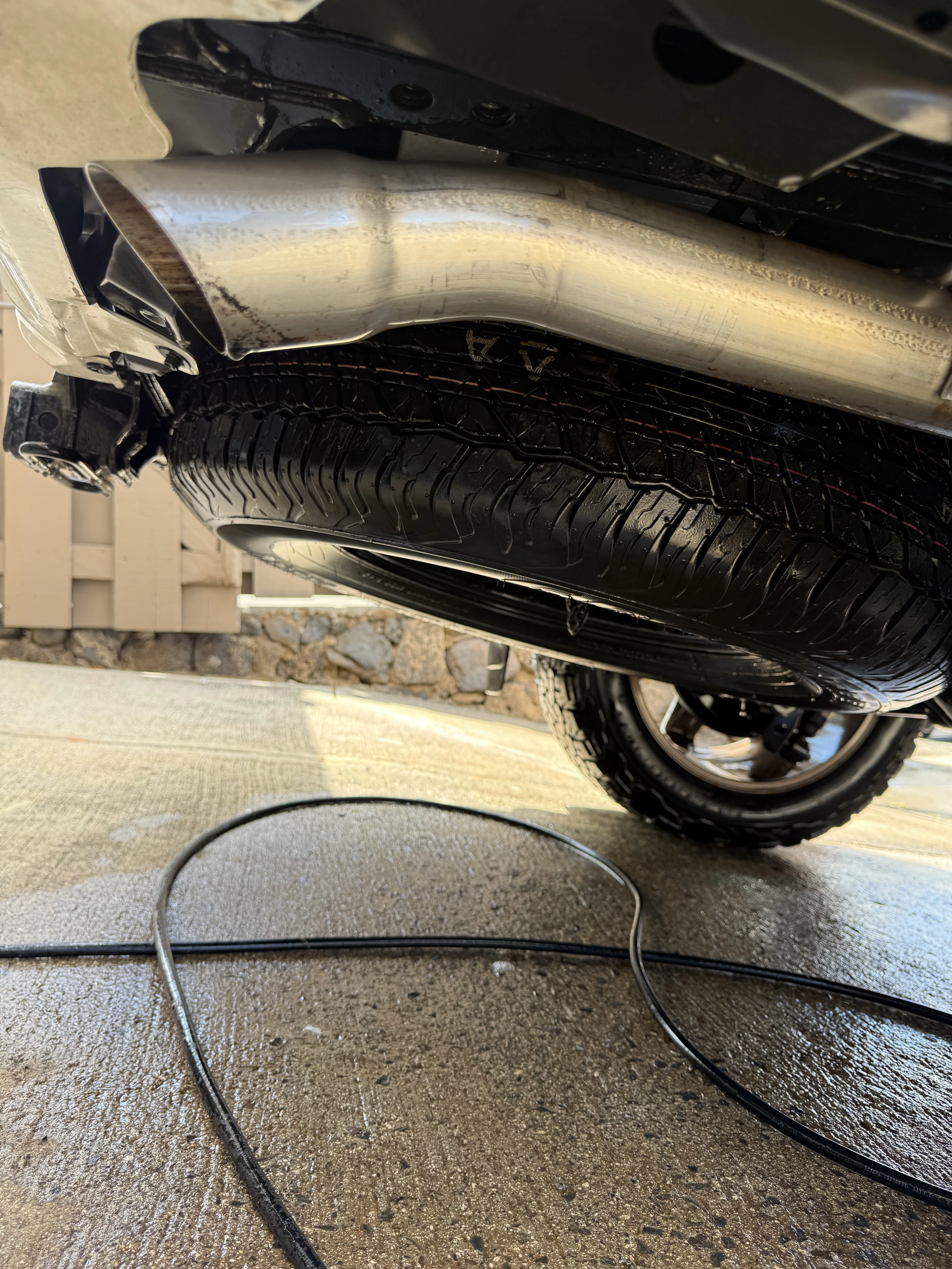 Polished, chrome-bright exhaust tip on a Toyota 4Runner after Chopped Details detailing